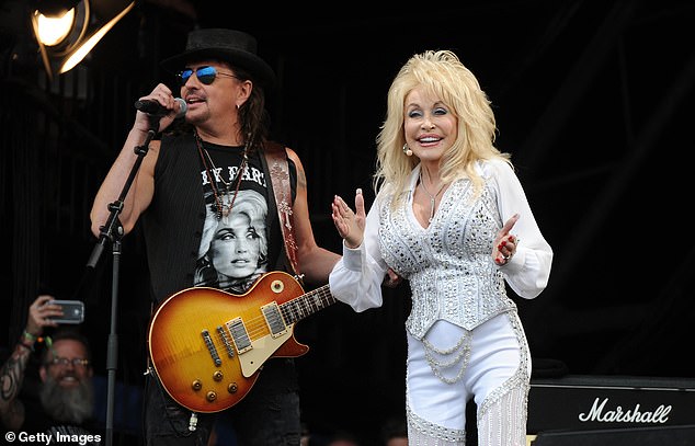 Dolly pictured performing at Glastonbury Festival with Bon Jovi guitarist Richie Sambora in 2014