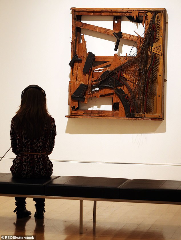 Pictured: The destroyed piano that once hung on Cosmo's parents' wall is now displayed at  Tate Britain