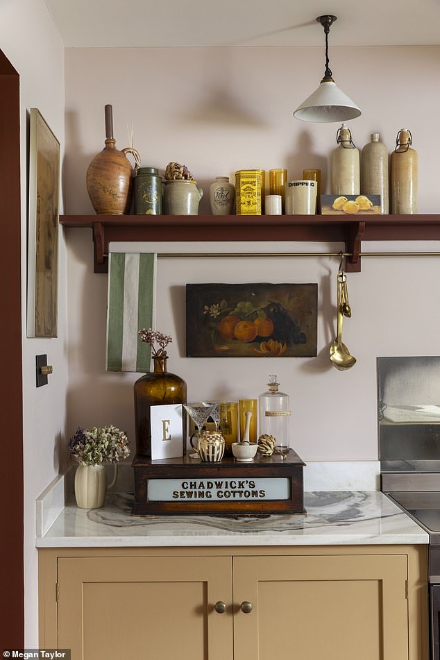 Hannah splashed out on devolkitchens.co.uk cabinets and marble worktops, but saved money with a reclaimed wooden shelf that she has accessorised with vintage pots and jars from charity shops, auctions and Instagram sellers