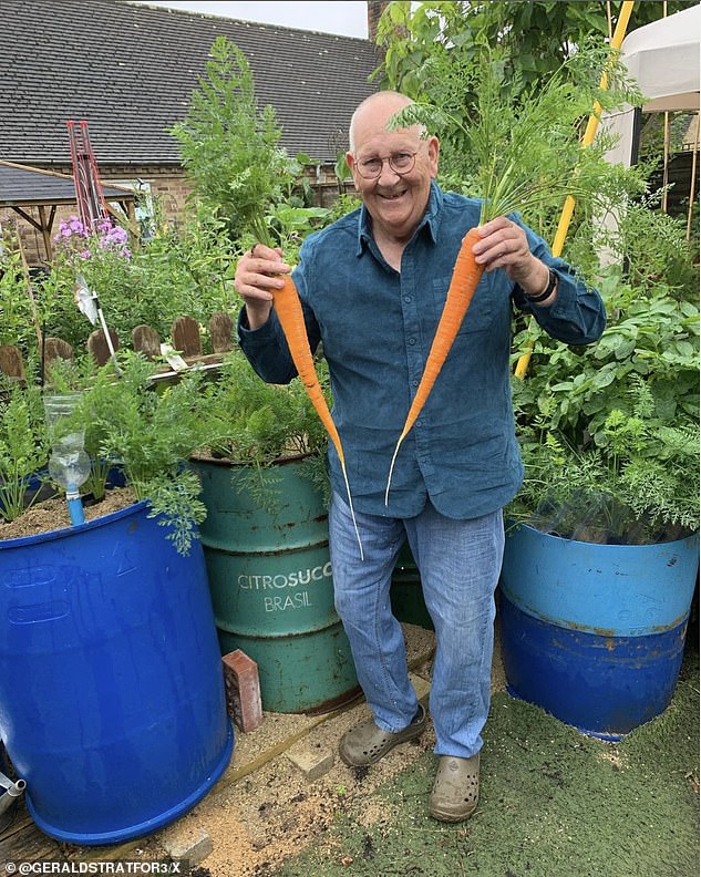 PROUDLY SHOWING OFF HIS MASSIVE CARROTS. Before Stratford became a fashion star, he was a butcher, a Thames barge operator and a 'fanatical' amateur fisherman