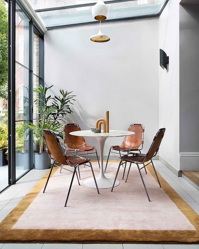 The golden rule for the dining room is to opt for a rug that is approx 100cm to 120cm larger than the table, so that chairs don’t get caught on the edges. It will also frame the table nicely. Mohair Border Rose Quartz rug, £2,902, therugcompany.com