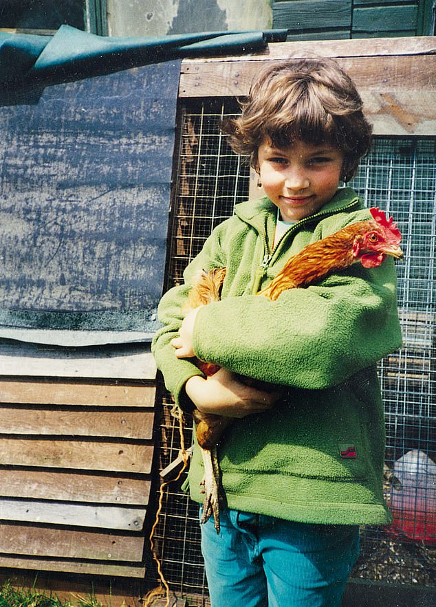 Arthur, aged nine, with one of his first chickens. He got his very first chicken at the tender age of seven