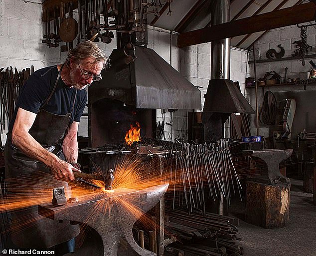 Hector Cole working at his forge.